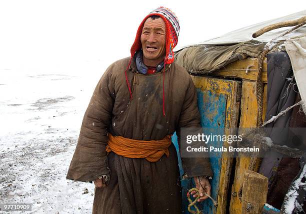 Muukhbayar stands by the ger where he keeps 45 animals protected from the extremes of cold weather on March 14, 2010 in Sergelen, in Tuv province in...