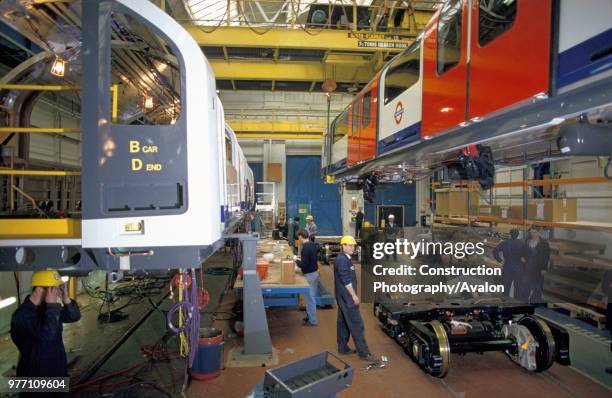 Stock under construction at BREL, Derby. Lowering carriage onto bogie, circa 1993.