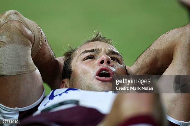 Brett Stewart of the Eagles receives attention for a knee injury during the round one NRL match between the Wests Tigers and the Manly Warringah Sea...