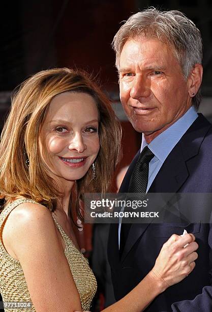 Cast member Harrison Ford arrives with his girlfriend, actress Calista Flockhart for the premiere of CBS Films "Extraordinary Measures" at Grauman�s...