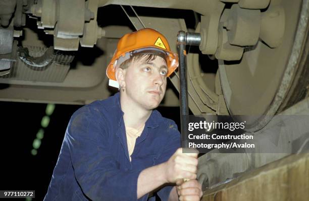 Maintenance worker at Bounds Green InterCity depot, London, circa 1993.