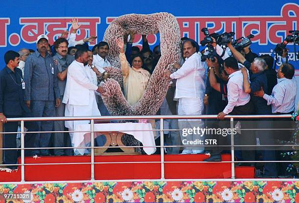 Bahujan Samaj Party leader and Uttar Pradesh state Chief Minister Mayawati waves to a crowd at a party anniversary rally in Lucknow on March 15,...