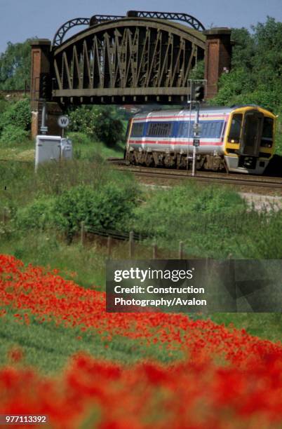 Class 159 DMU passes under Battledown Flyover near Basingstoke with a train from Salisbury. C2000.