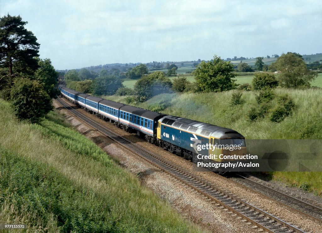 Aynho Mill. No.47664 heads north with the 06:34 ex Poole for Manchester. 18.06.1988.