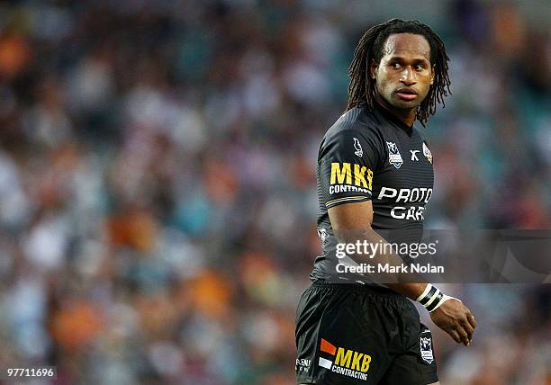 Lote Tuqiri of the Tigers watches on during the round one NRL match between the Wests Tigers and the Manly Warringah Sea Eagles at the Sydney...