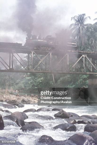 Lima 3 Truck Shay No 12 of the Insular Lumber Company on the Philippine island of Negros crosses the viaduct at Base Camp Minapasuk on Saturday 26th...