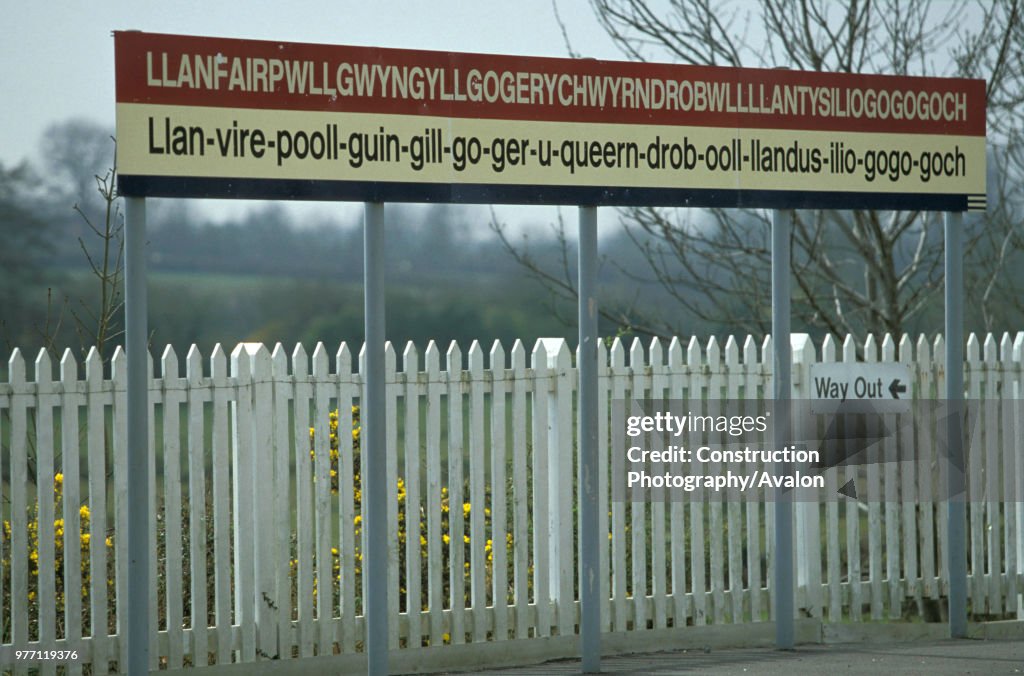 Llanfairpwllgwyngyllgogerychwyrndrobwllllantysiliogogogoch station sign in Anglesey.  Britain's longest station name.