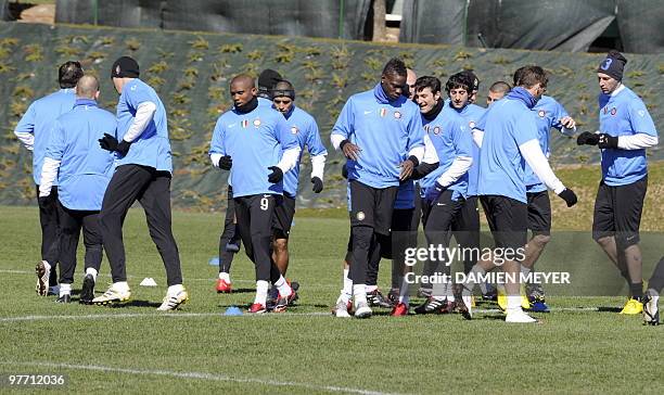 Inter Milan team players warm-up during a training session on the eve of their UEFA Champions League football match against Chelsea on March 15, 2010...
