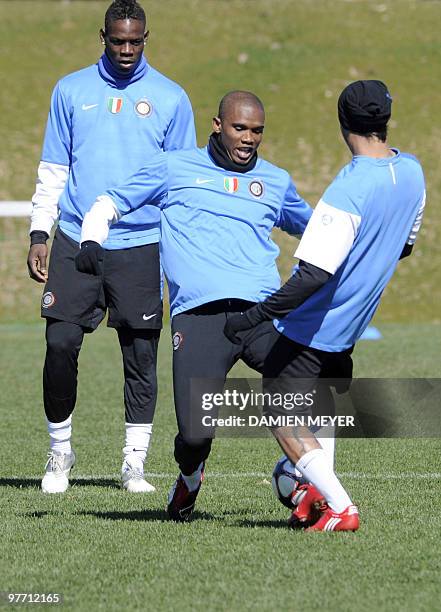 Inter Milan's Cameroonian forward Samuel Eto'o and forward Mario Balotelli attend a training session on the eve of their UEFA Champions League...