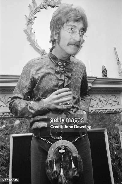 John Lennon wearing a frilly shirt and a sporran at the press launch for the Beatles' new album 'Sergeant Pepper's Lonely Hearts Club Band', held at...