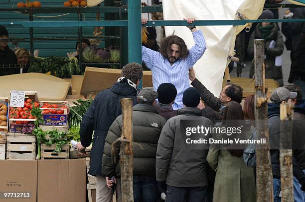 Stuntman land on a fruit stall during the filming of "The Tourist" at the Mercato del Pesce on March 15, 2010 in Venice, Italy.