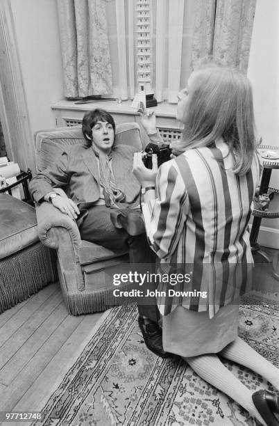 American photographer Linda Eastman takes pictures of Paul McCartney at the press launch for the Beatles' new album 'Sergeant Pepper's Lonely Hearts...