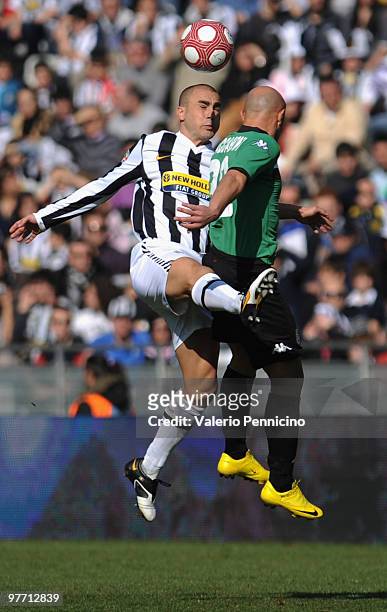 Fabio Cannavaro of Juventus FC clashes with Massimo Maccarone of AC Siena during the Serie A match between Juventus FC and AC Siena at Stadio...