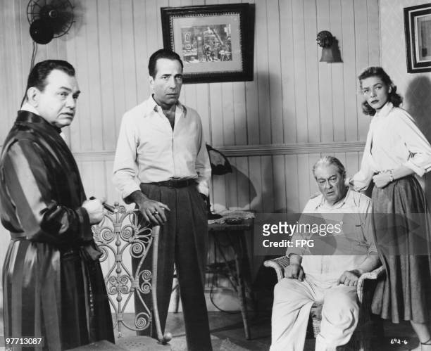 Edward G. Robinson , Humphrey Bogart , Lionel Barrymore and Lauren Bacall in a scene from 'Key Largo', directed by John Huston, 1948.