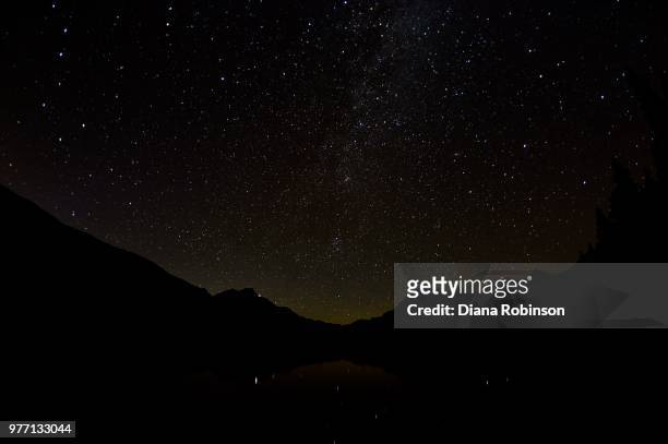 stars over bowman lake - bowman lake stock pictures, royalty-free photos & images
