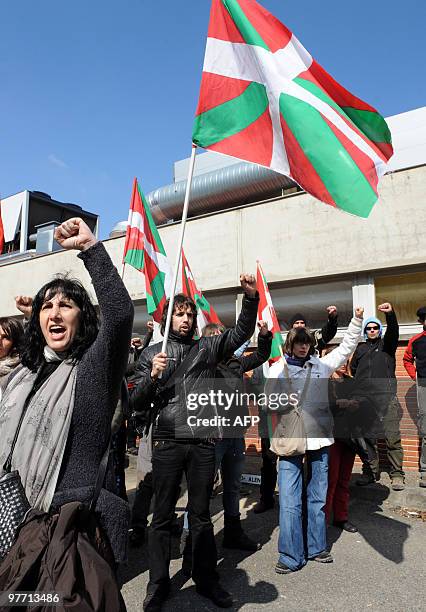 Members of the Jon Anza Committee, a member of the armed Basque separatist group ETA who disappeared nearly a year ago, sing during a demonstration...