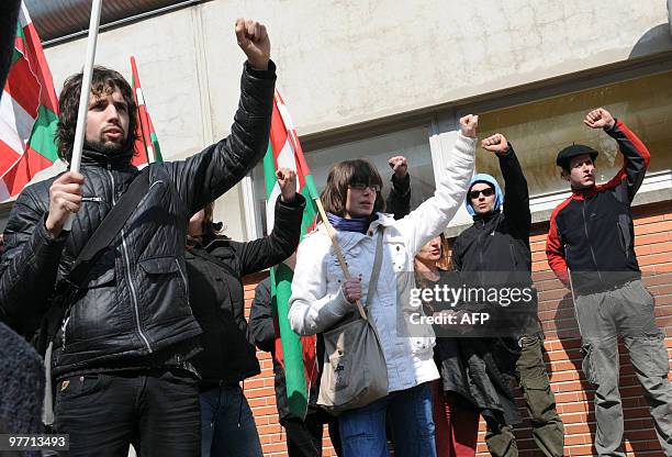 Members of the Jon Anza Committee, a member of the armed Basque separatist group ETA who disappeared nearly a year ago, sing during a demonstration...