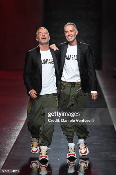 Designer Dean and Dan Caten acknowledge the audience at the end of the Dsquared2 show during Milan Men's Fashion Week Spring/Summer 2019 on June 17,...