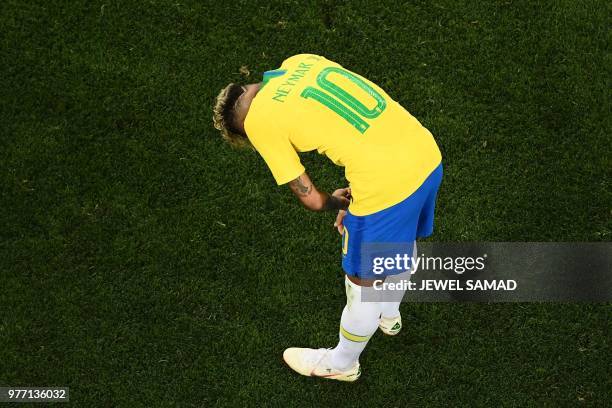 Brazil's forward Neymar reacts during the Russia 2018 World Cup Group E football match between Brazil and Switzerland at the Rostov Arena in...