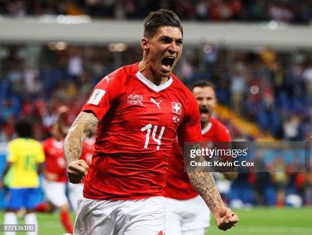 Steven Zuber of Switzerland celebrates after scoring his team's first goal during the 2018 FIFA World Cup Russia group E match between Brazil and...