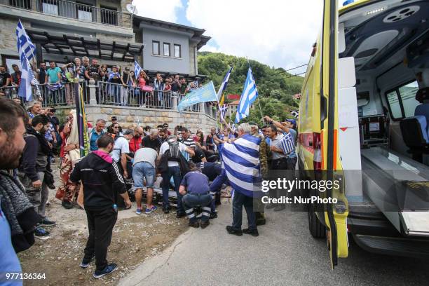 Protestors holding Greek flags clash with riot police during a protest at the village of Pisoderi near the border with Macedonia in northern Greece...