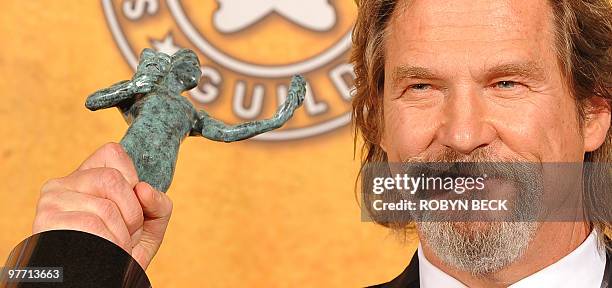 Jeff Bridges holds the trophy for Outstanding Performance by a Male Actor in a Leading Role for "Crazy Heart" at the 16th annual Screen Actors Guild...