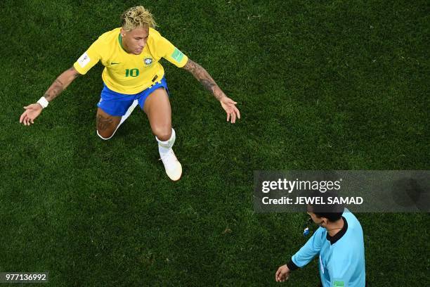 Brazil's forward Neymar reacts in front of referee Cesar Ramos during the Russia 2018 World Cup Group E football match between Brazil and Switzerland...