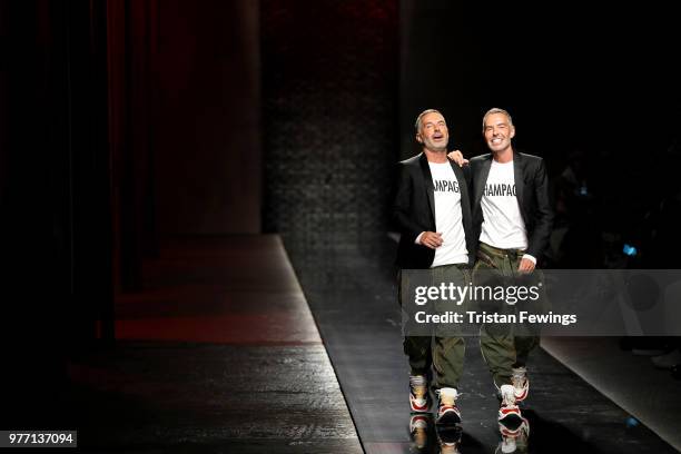 Fashion designers Dean and Dan Caten acknowledges the audience on the runway at the Dsquared2 show during Milan Men's Fashion Week Spring/Summer 2019...