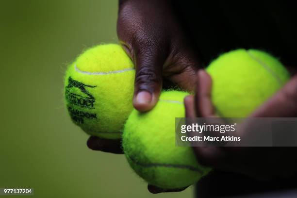Slazenger tennis balls in the hands of a ball girl during qualifying Day 2 of the Fever-Tree Championships at Queens Club on June 17, 2018 in London,...
