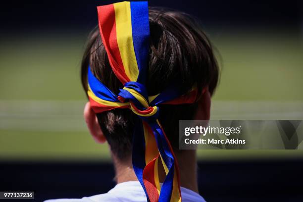 Fan wears a ribbon in their hair in the colours of the Romanian National flag during qualifying Day 2 of the Fever-Tree Championships at Queens Club...