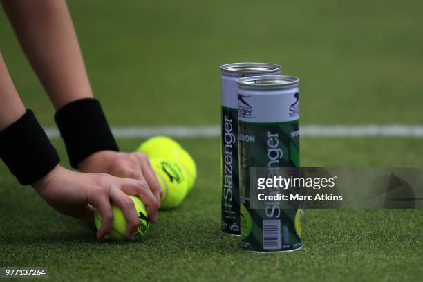 Slazenger tennis balls in the hands of a ball girl during qualifying Day 2 of the Fever-Tree Championships at Queens Club on June 17, 2018 in London,...