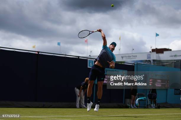 John Millman of Australia serves during his match against Marius Copil of Romania during qualifying Day 2 of the Fever-Tree Championships at Queens...