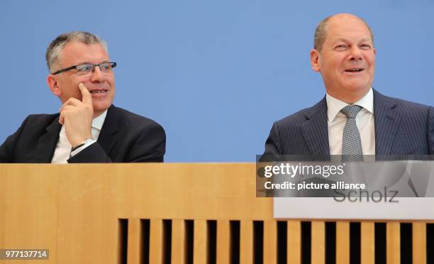 May 2018, Germany, Berlin: Minister of Finance, Olaf Scholz of the Social Democratic Party , and German Secretary of the Ministry of Finance, Werner...