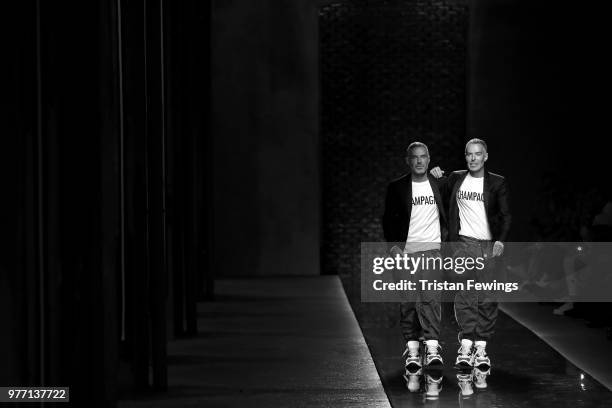 Fashion designers Dean and Dan Caten acknowledges the audience on the runway at the Dsquared2 show during Milan Men's Fashion Week Spring/Summer 2019...