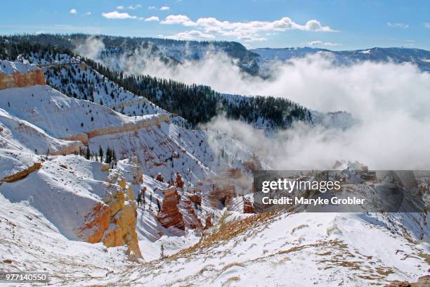 clouds over snowy mountains, brian head, utah, usa - iron county stock-fotos und bilder