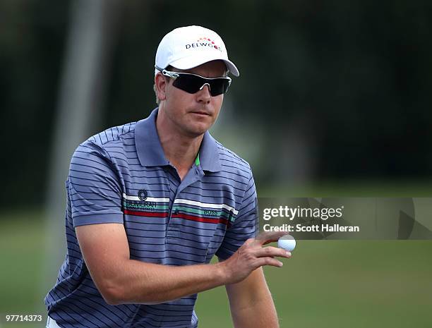 Henrik Stenson of Sweden plays a shot on the seventh hole during the final round of the 2010 WGC-CA Championship at the TPC Blue Monster at Doral on...