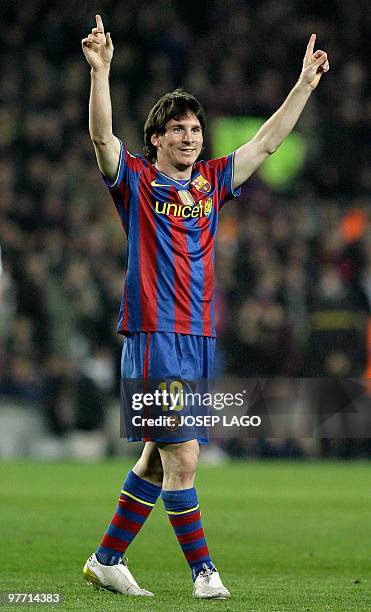 Barcelona's Argentinian forward Lionel Messi celebrates his goal during a Spanish League football match against Valencia at the Camp Nou Stadium in...