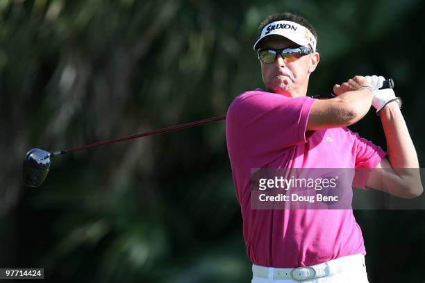 Robert Allenby of Australia tees off on the 12th tee box during the final round of the 2010 WGC-CA Championship at the TPC Blue Monster at Doral on...