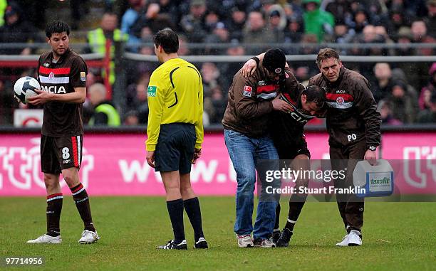 Matthias Lehmann of St. Pauli is carried off injured during the Second Bundesliga match between FC St. Pauli and Rot-Weiss Oberhausen at the...