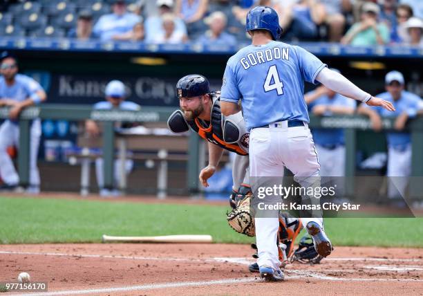 Houston Astros catcher Brian McCann drops the throw home allowing Kansas City Royals' Alex Gordon to score on a ground ball by Hunter Dozier in the...