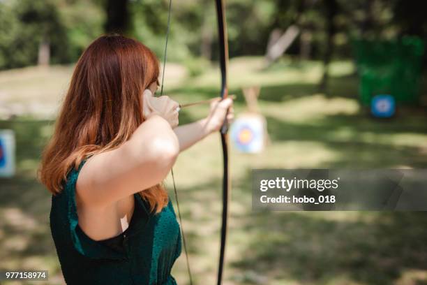 female archer in the fieald - longbow stock pictures, royalty-free photos & images