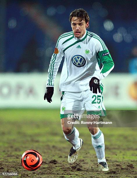 Christian Gentner of Wolfsburg runs with the ball during the UEFA Europa League round of 16 first leg match between Rubin Kazan and VfL Wolfsburg at...