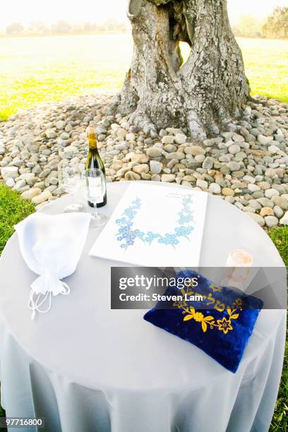 modern jewish wedding ceremony items on table - kiddush cup stock-fotos und bilder