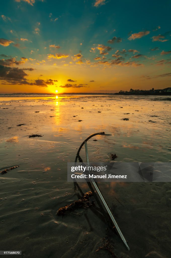 Sunrise over beach with anchor, Cadiz, Negros Occidental, Philippines