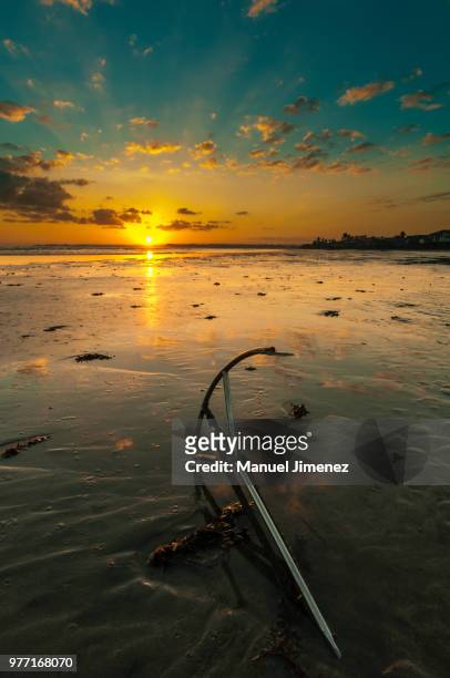 sunrise over beach with anchor, cadiz, negros occidental, philippines - asia occidental stock pictures, royalty-free photos & images
