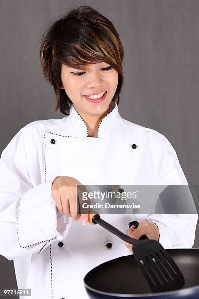 female chef - straining spoon stock pictures, royalty-free photos & images