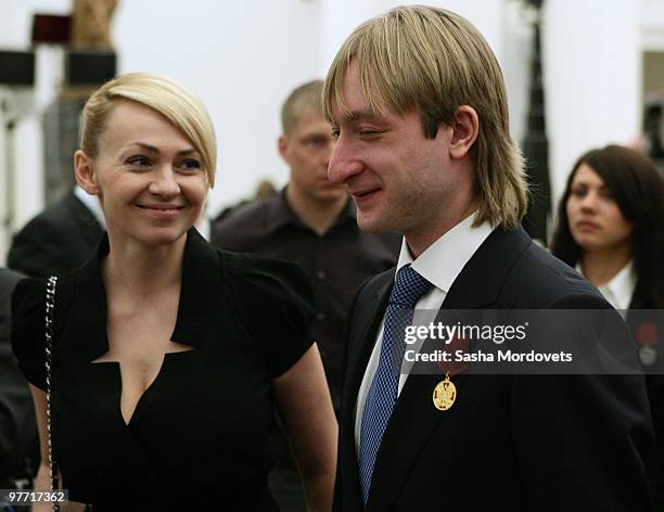 Silver medalist figure skater Evgeni Plushenko and his wife producer Yana Rudkovskaya attend a ceremony at the Kremlin March 15, 2010 in Moscow,...