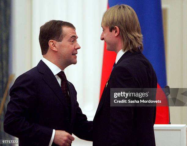 Russian President Dmitry Medvedev presents silver medalist figure skater Evgeni Plushenko with an order at the Kremlin March 15, 2010 in Moscow,...