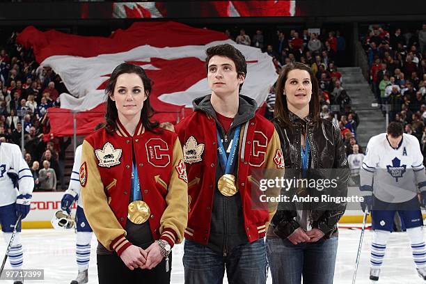 Olympic gold medalists Tessa Virtue, Scott Moir and Jennifer Botterill are acknowledged at center ice prior to a game between the Ottawa Senators and...