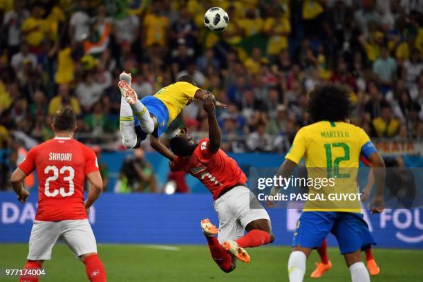 Brazil's midfielder Fernandinho and Switzerland's forward Breel Embolo compete for the ball during the Russia 2018 World Cup Group E football match...